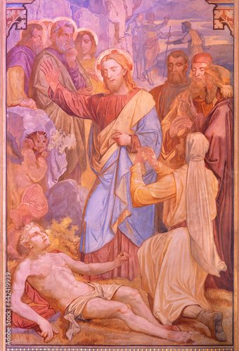 VIENNA, AUSTIRA - JUNI 24, 2021: The fresco Jesus exorcising a boy possessed by a demon in the Votivkirche church by brothers Carl and Franz Jobst (sc. half of 19. cent.).