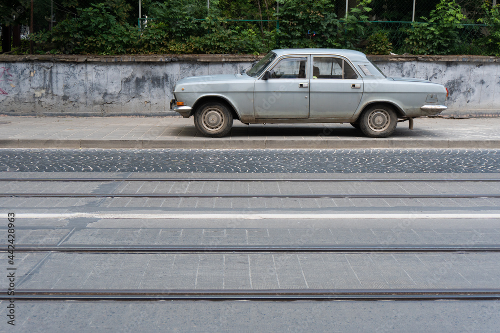 Silver car on the street. 