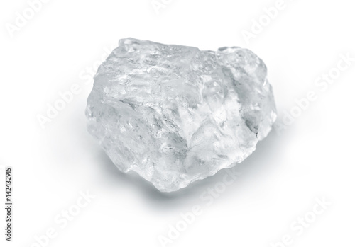 A chunk or crystal of Himalayan rock salt also  known as Halite. Isolated on white.