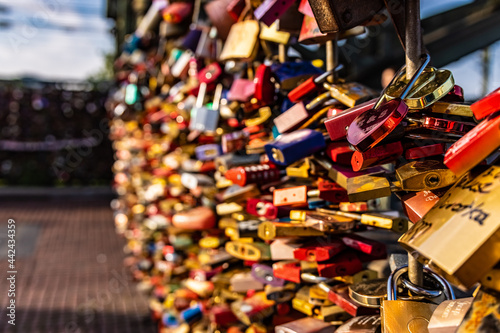 Locks attached to a bridge as a sign of love - COLOGNE, GERMANY
