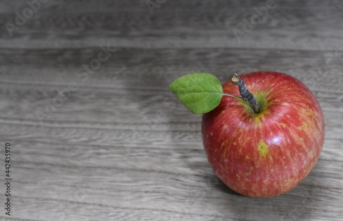 red apple on wooden background