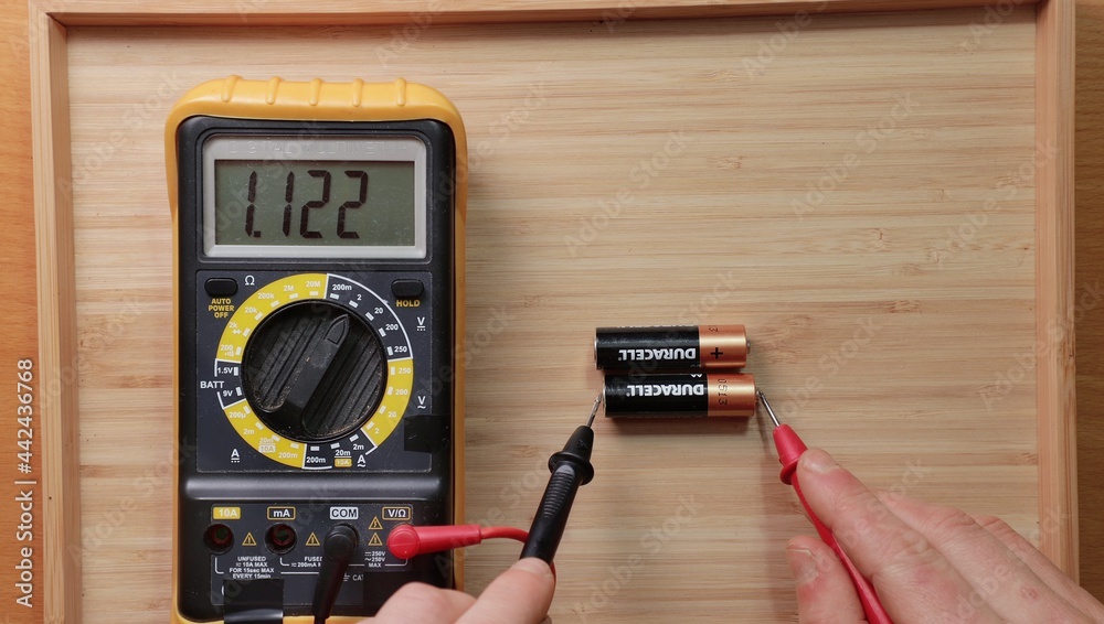 AA battery cells voltage checking Stock Photo Adobe Stock