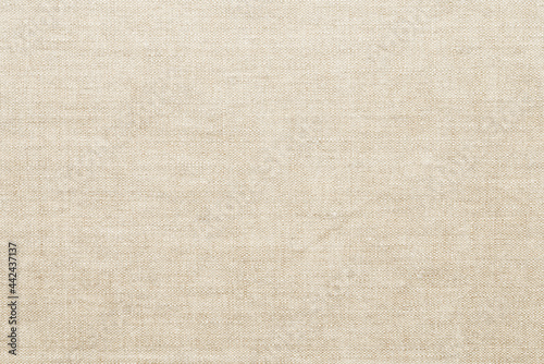 Linen fabric texture background. Natural champagne beige cloth surface closeup