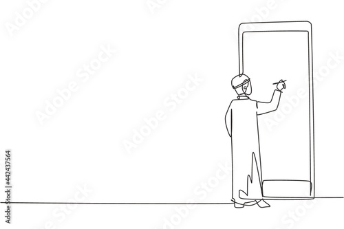 Single continuous line drawing Arabian male junior high school student writing on giant smartphone screen like he was writing on whiteboard. Dynamic one line draw graphic design vector illustration