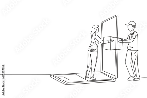 Single continuous line drawing male courier delivers box package, through laptop screen to female customer. Online delivery service concept. Dynamic one line draw graphic design vector illustration