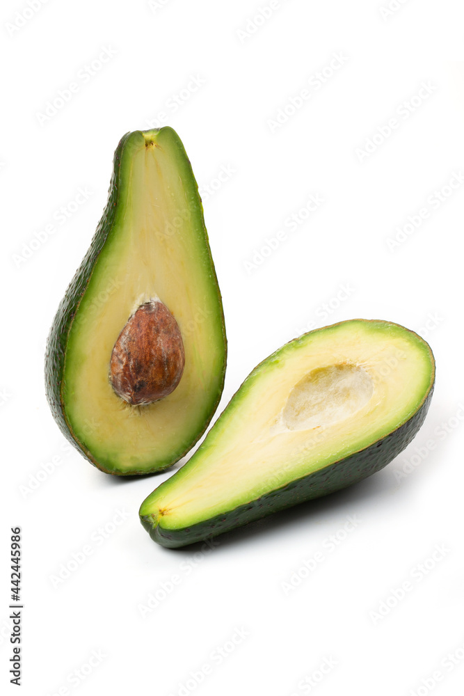 Two halves of avocado slices isolated on a white background