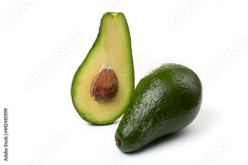 Avocado whole fruit and slices, isolated on a white background