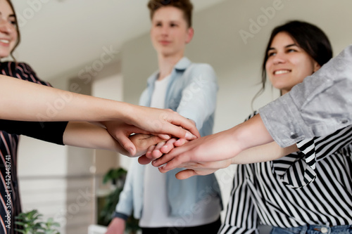 Group of people doing handshake and cross hands