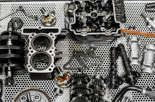 spare parts were placed on a metal table.