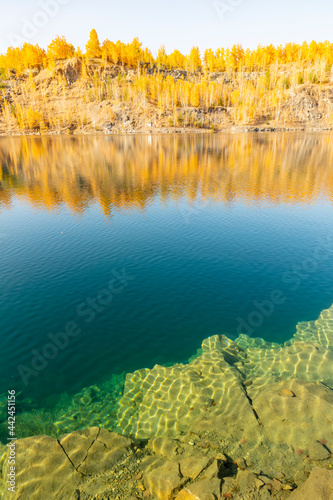 a beautiful flooded gold mine near the village of Mindyak on a sunny autumn day. photo