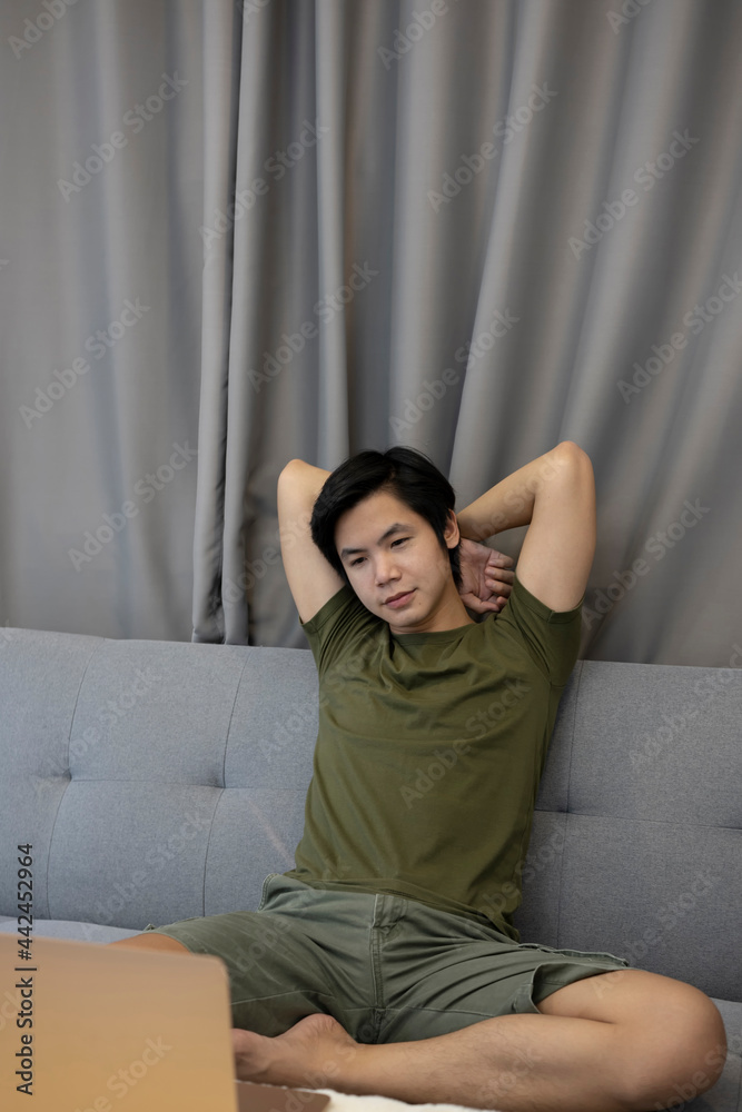 Young man resting on sofa at home. Young man resting on sofa at home.