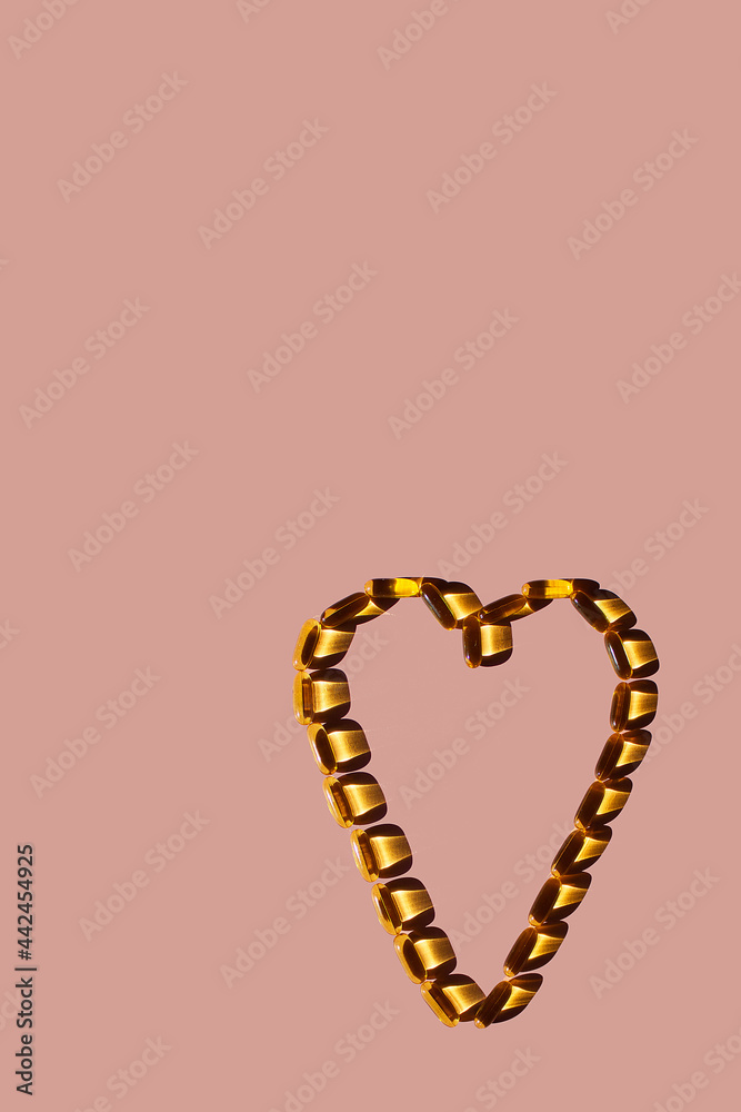 Obraz premium Omega 3, on a pink background