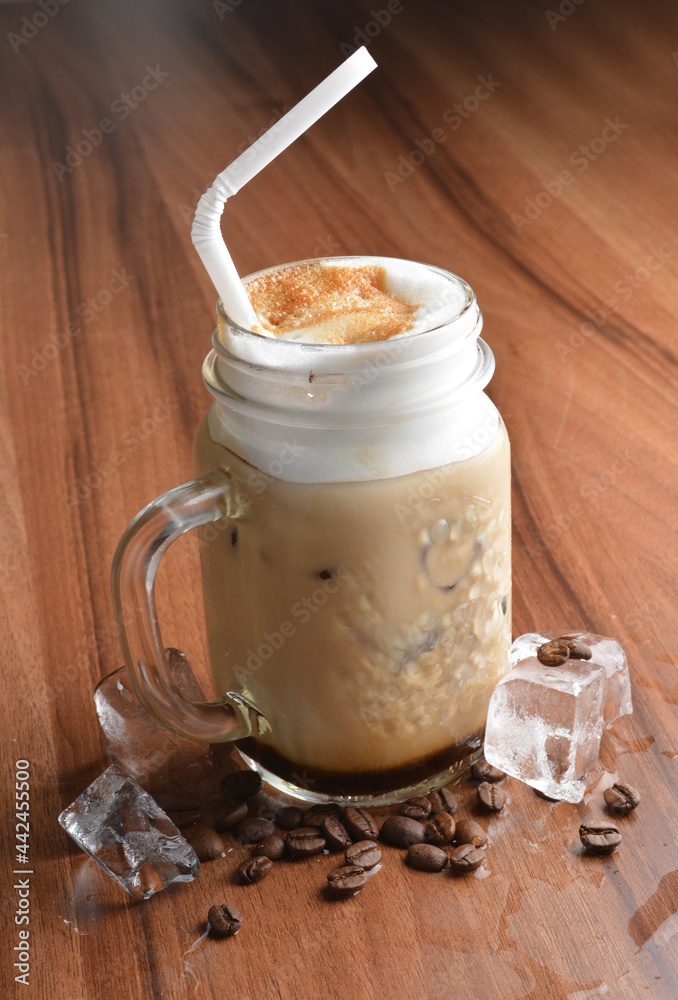 ice cafe mocha latte drink with bubbles and coffee bean in glass on wood table coffee beverage menu ice cafe mocha latte drink with bubbles and coffee bean in glass on wood table coffee beverage menu
