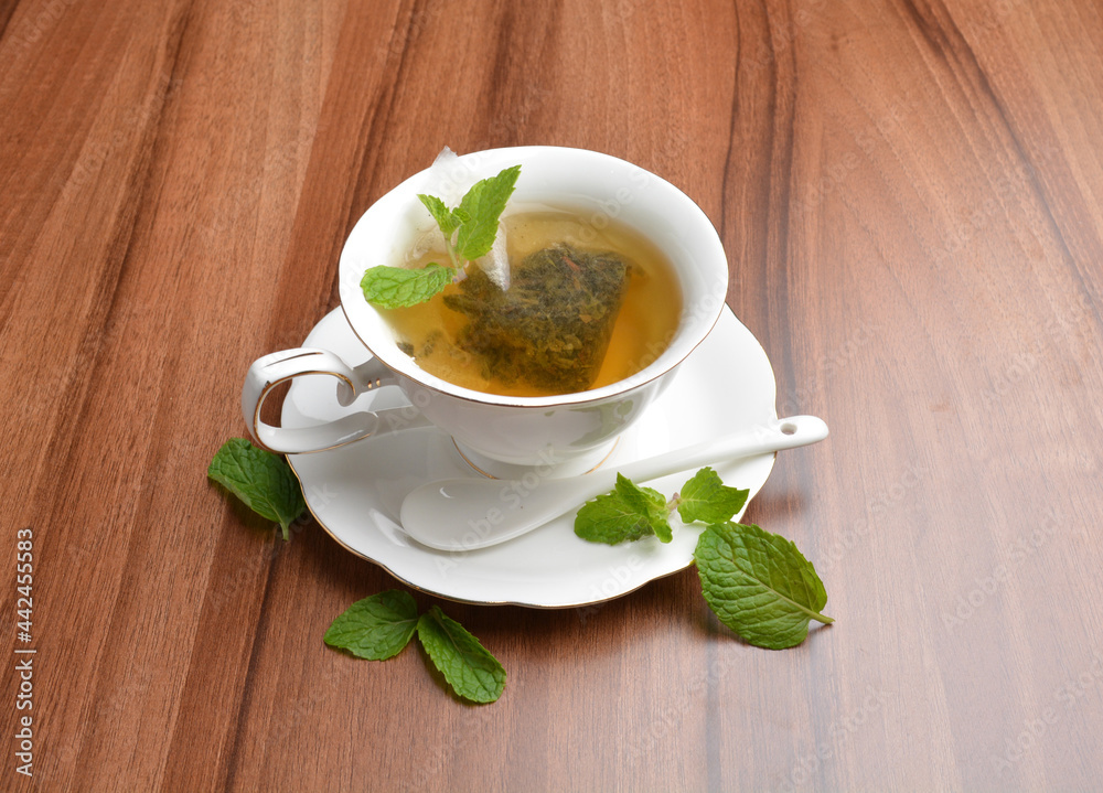 hot moroccan mint leaf tea bag drink in beautiful England design white cup hot healthy beverage menu hot moroccan mint leaf tea bag drink in beautiful England design white cup hot healthy beverage menu