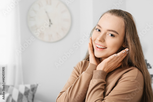 Beautiful young woman at home