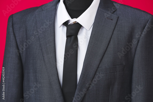 Mannequin with stylish male suit on color background, closeup