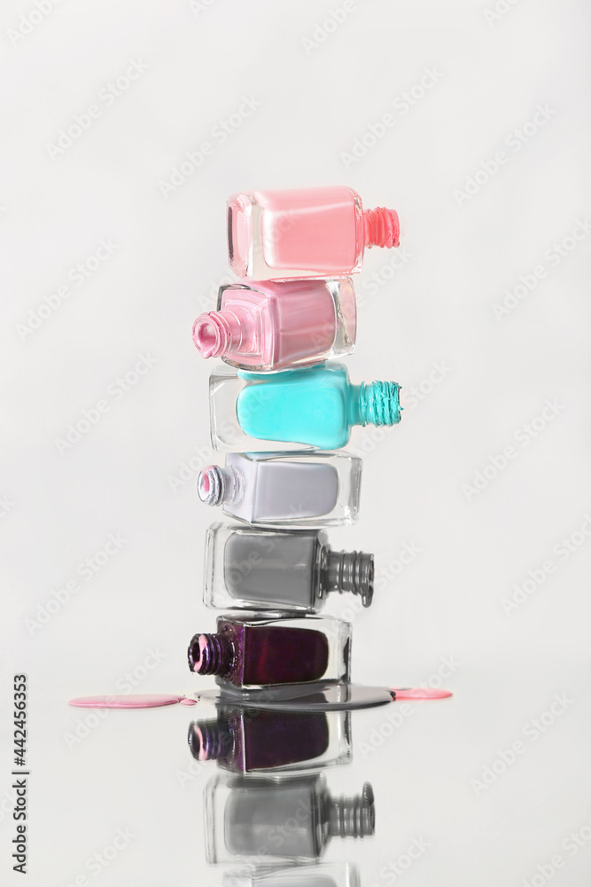Different nail polishes on white background Different nail polishes on white background