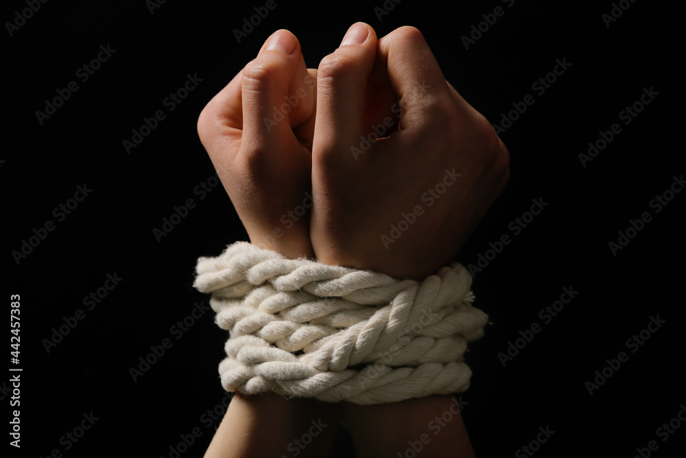 Female hostage with tied hands on dark background, closeup Stock Photo ...