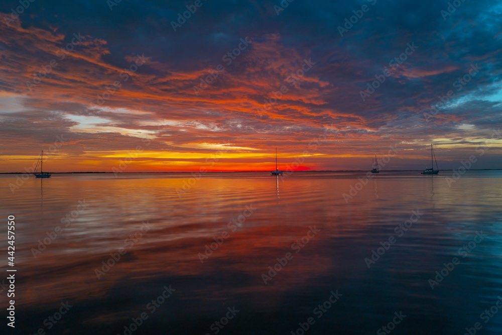 Panoramic view of sunset over ocean. Beautiful serene scene. Sea sky concept, sunrise colors clouds. Nature landscape, scenery beach. Summer vacation background. Panoramic view of sunset over ocean. Beautiful serene scene. Sea sky concept, sunrise colors clouds. Nature landscape, scenery beach. Summer vacation background.