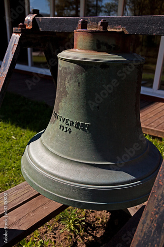 an old church bell in metal with the text: Pilotship