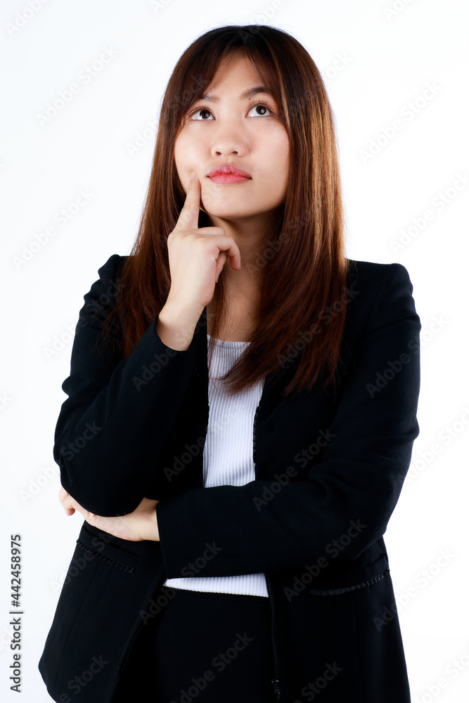 Young and cute businesswoman in formal black suit pose in thinking gesture on white background. Young and cute businesswoman in formal black suit pose in thinking gesture on white background.