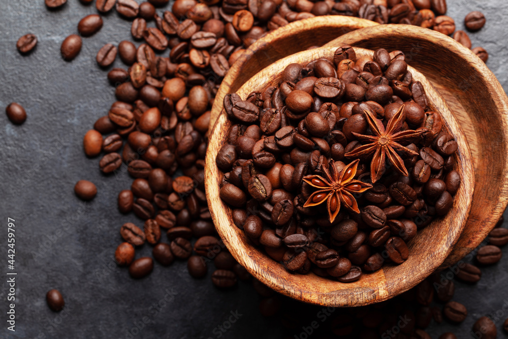 Fototapeta premium Roasted coffee beans in wooden bowl