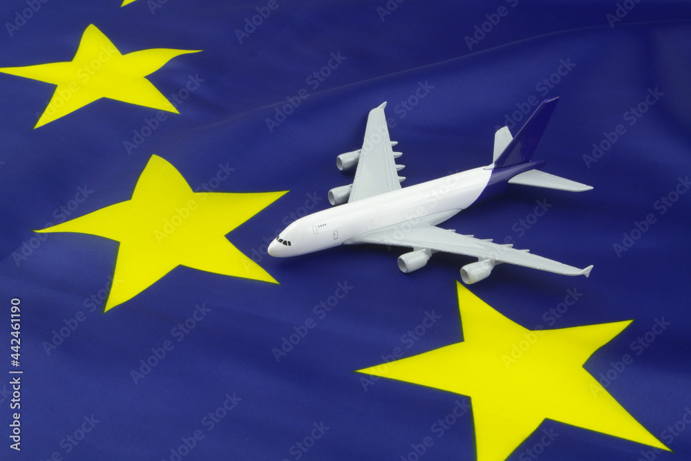 Airplane model on European Union flag. Travel and transportation in EU concept. Airplane model on European Union flag. Travel and transportation in EU concept.