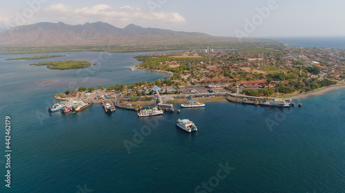 Aerial view ferry port gilimanuk with ferry boats, vehicles. Ferries transport vehicles and passengers in port. Port for departure from Bali to the island of Java.