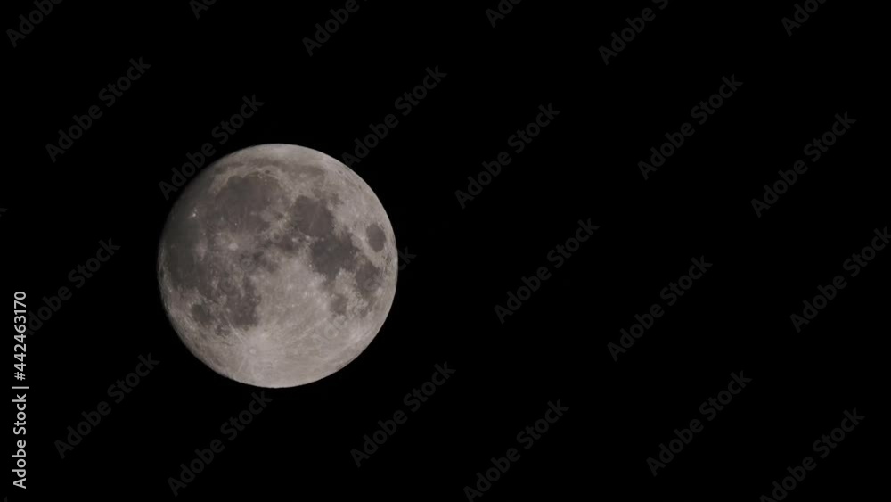 Full moon closeup slides on a night sky background. Real life footage Full moon closeup slides on a night sky background. Real life footage