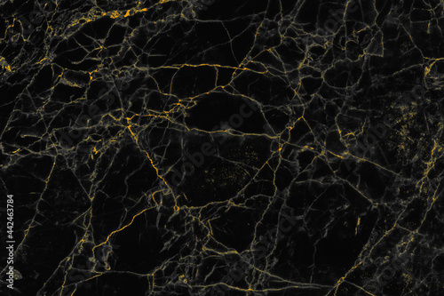 Abstract golden and black marble stone texture for background and wallpaper decorative design.