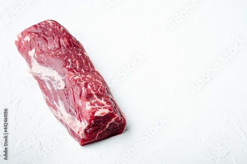 Organic beef meat raw steak, Filet mignon cut, on white stone surface, with copy space for text
