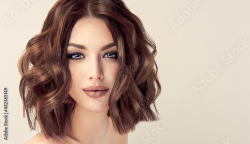 Beautiful model girl with short hair .Woman brunette with curly hair. Red head . 
