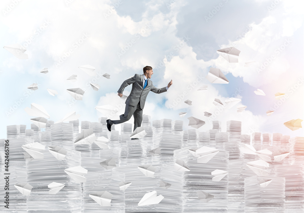 Precise businessman in suit running with phone. Precise businessman in suit running with phone.
