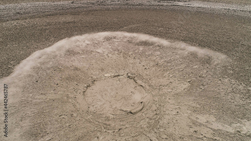 Mud volcano with bursting bubble bledug kuwu. aerial view volcanic plateau with geothermal activity and geysers, Indonesia java. aerial view volcanic landscape photo