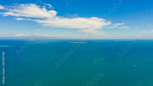 Aerial seascape  Tropical Islands and blue sea against the sky with clouds. The Strait Of Cebu Philippines.