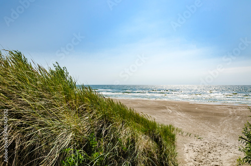 Fototapeta Naklejka Na Ścianę i Meble -  Sand dunes over blue sea.