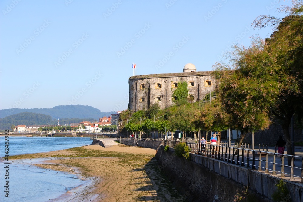 17th century Saint Martin Fort built into the side of the Buciero hill next to the seafront of Santona Cantabria Spain on a sunny June morning