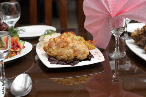 Wallpaper Mural Kiev cutlet made of meat fried in breadcrumbs with a side dish of rice is on the banquet table Torontodigital.ca