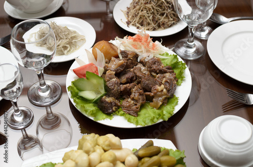 Wallpaper Mural Pieces of delicious stewed lamb meat with potatoes in a plate on the banquet table Torontodigital.ca