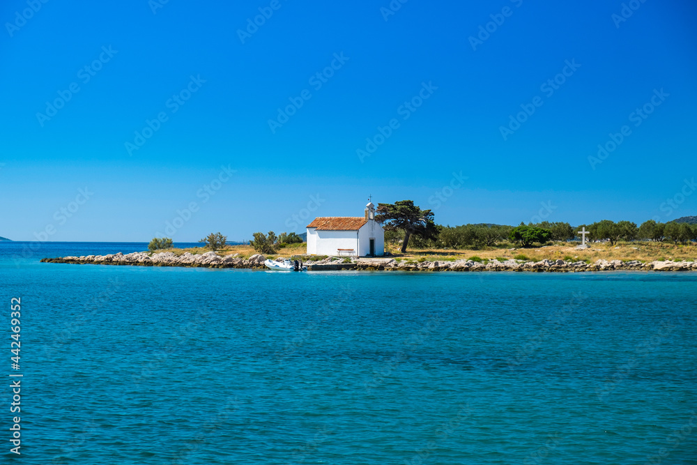 Church on the island of St Justina in Adriatic sea in Croatia, near town of Pakostane