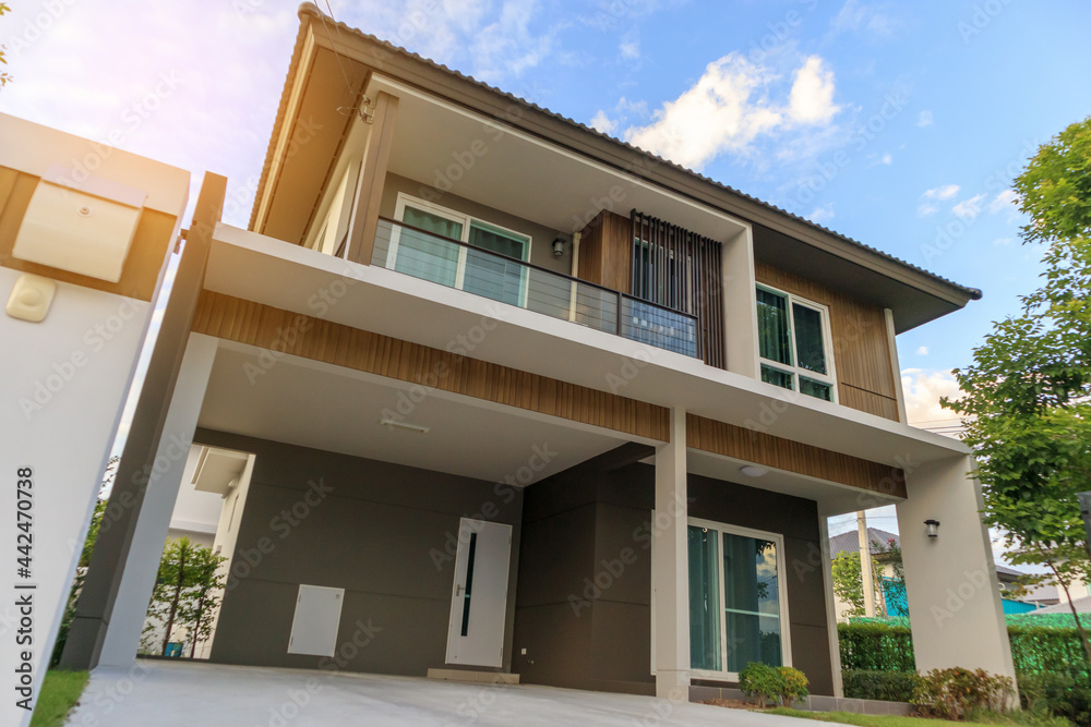 Beautiful modern house exterior with green grass