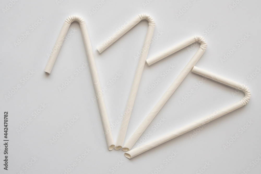 Biodegradable eco friendly white paper drinking straw on white background