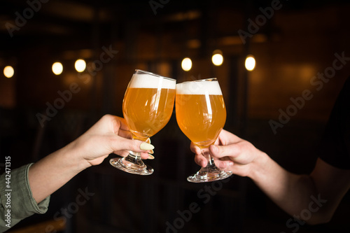 beer glasses in hands
