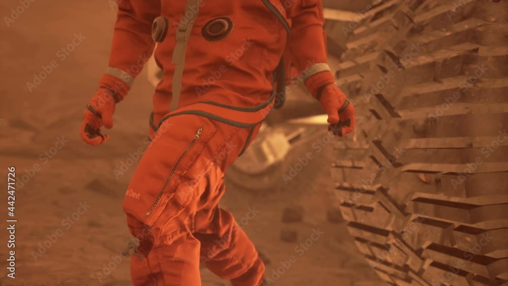 An astronaut on the surface of Mars examines the vicinity of the planet ...
