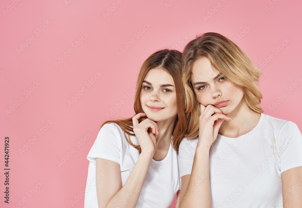 two cute girlfriends in white t-shirts emotions friendship fashion
