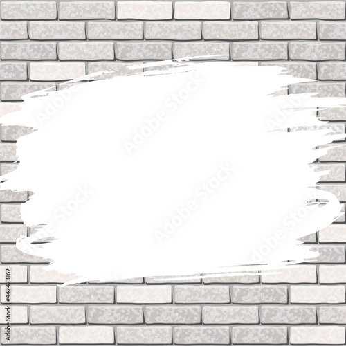 A stain of white paint on a gray brick wall. White painted area on a brick wall backdrop. Copy space