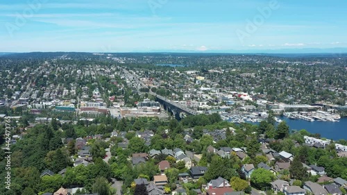 Drone flying over upper Queen Anne in Seattle with views of Lake Union,  Gas Works Park, University of Washington and Fremont on a clear sunny day. photo