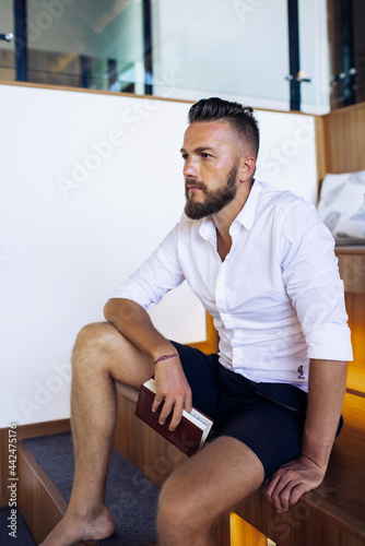 Young european man with notepad.