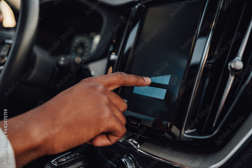 Shot of hand putting on panel of car Shot of hand putting on panel of car