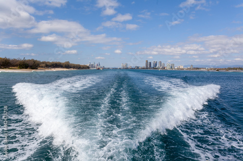 Fototapeta Naklejka Na Ścianę i Meble -  Waves on the stern of a tourist boat, Gold Coast, Australia